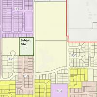 A zoning map with a green rectangle that says subject site.