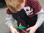 Child playing with Legos