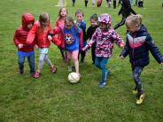 Children playing soccer at Start Smart