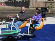 Child and Adult Playing on Inclusive and Accessible Play Structure at Jay Pearson Neighborhood Park