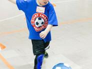 Child kicking soccer ball at Start Smart Soccer