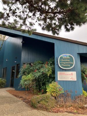 The entrance of the Community Development Center.  A sign says "Building, Engineering, Planning"