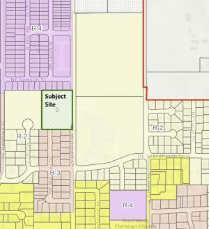 A zoning map with a green rectangle that says subject site.