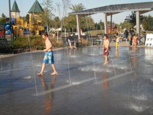 Children Playing in Splash Pad at Discovery Meadows Park