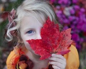 Girl with Fall Leaf