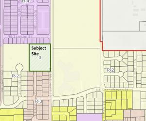A zoning map with a green rectangle that says subject site.