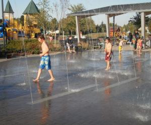 Children Playing in Splash Pad at Discovery Meadows Park